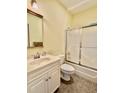 Cozy bathroom features a shower/tub combo, vanity with sink, and a tiled floor at 84 Dogeye Rd, Benson, NC 27504