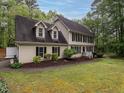 Charming traditional two-story home with neat landscaping and a welcoming yard at 8805 Stage Ford Rd, Raleigh, NC 27615