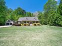 A delightful single-Gathering house with a well-kept lawn and a separate garage. The property features a classic brick facade at 936 Elbridge Dr, Raleigh, NC 27603