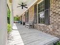 The home has a beautiful front porch with a seating area and ceiling fans, offering a comfortable outdoor space at 936 Elbridge Dr, Raleigh, NC 27603