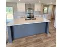 Modern kitchen with stainless steel appliances, a spacious island, and ample cabinet space at 10 Riverview Rd, Erwin, NC 28339