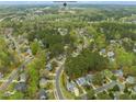Aerial view showcasing the community layout amidst lush greenery at 101 Rustic Pine Ct, Apex, NC 27502