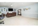 Spacious living area with a fireplace, neutral tones, and an open layout leading to the kitchen area at 104 Hamby Ct, Garner, NC 27529