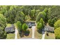 Aerial view of home nestled in a wooded area, highlighting the surrounding landscape and neighborhood at 105 Coral Ridge Cir, Franklinton, NC 27525