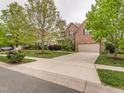 Suburban two-story home with a long driveway and beautiful mature trees in a well-maintained neighborhood at 111 Gathering Place Pl, Durham, NC 27713