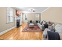 Cozy living room with fireplace and large sofa, perfect for relaxation at 12308 Bunchgrass Ln, Raleigh, NC 27614