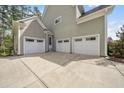 Large three-car garage providing plenty of parking and storage space at 1305 Reservoir View Ln, Wake Forest, NC 27587