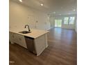 Open-concept kitchen with an island that offers a lot of counter space and stainless appliances at 168 Parker Ln, Mebane, NC 27302