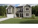 Charming two-story home with a covered porch, attached garage, and well-maintained landscaping at 1809 Harrell Cove Ct Ct # 181 Gunnison Fc, Fuquay Varina, NC 27526