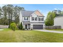 Beautiful two-story home featuring a well-kept lawn, gray siding, and a welcoming two-car garage at 218 Darecrest Ln, Wendell, NC 27591