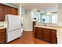 Bright kitchen showcasing ample counter space, wood cabinetry, and seamless flow into the living area for modern living at 2813 Market Bridge Ln # 204, Raleigh, NC 27608