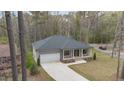 An aerial view showcasing the home's roofline and expansive driveway at 3011 Bourbon St, Sanford, NC 27332