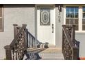 Close-up of the front door with decorative glass and newly painted stairs leading to the entrance at 305 Gillis Rd, Roxboro, NC 27574