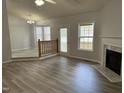 Bright living room with fireplace and hardwood floors at 308 Caroline Dr, Wendell, NC 27591
