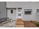 Inviting front entrance with a bench, landscaping, and a charming welcome mat at 7383 Sandy Creek Dr, Raleigh, NC 27615