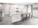 Spacious kitchen with white cabinets, granite countertops, and stylish pendant lighting at 812 Walker Ridge Way, Willow Springs, NC 27592