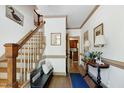 Elegant foyer with hardwood floors, staircase, and decorative accents creates a welcoming atmosphere at 8120 Stillbreeze Dr, Fuquay Varina, NC 27526