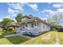 Charming home with a welcoming front porch, fresh paint, and well-maintained lawn at 813 S Franklin St, Rocky Mount, NC 27803