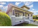 Charming house showcasing its covered front porch with white railings and attractive architectural details at 813 S Franklin St, Rocky Mount, NC 27803