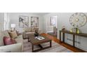 Cozy living room with hardwood floors, neutral-toned furniture, and stylish decor at 904 Emory Ln, Raleigh, NC 27609