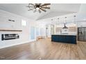 Bright, open living room with vaulted ceiling, a modern fireplace, and open concept to the kitchen at 1301 Tawny View Ln, Raleigh, NC 27603