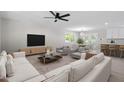 Open-concept living area with stylish seating and an adjacent dining space at 1514 Goodwin Rd, Durham, NC 27712