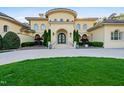 Beautiful home exterior featuring manicured lawn, front door and a circular driveway at 16 Portofino Pl, Durham, NC 27707