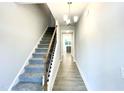 Bright entryway features hardwood floors, stairs, and access to the rest of the home at 177 Kipling Creek Dr, Fuquay Varina, NC 27526
