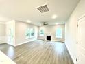 Spacious living room features hardwood floors, a fireplace, and plenty of natural light at 177 Kipling Creek Dr, Fuquay Varina, NC 27526