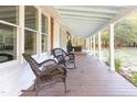 Inviting covered porch with rocking chairs, offering an outdoor living space for relaxation and enjoyment at 1835 Pearidge Rd, Angier, NC 27501