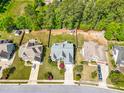 Overhead view of neighborhood homes, displaying the backyards, roofing, and perimeter fencing at 215 Terrell Dr, Rolesville, NC 27571