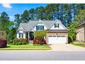 Charming two-story home with beautiful landscaping, stone accents and a two car garage at 215 Terrell Dr, Rolesville, NC 27571