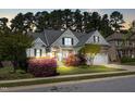 Charming two-story home with beautiful landscaping, stone accents and a two car garage at 215 Terrell Dr, Rolesville, NC 27571