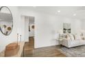 Bright living room featuring hardwood floors, white walls, and stylish decor at 2704 Dove Ln, Raleigh, NC 27604