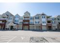 Attractive condo complex showcasing multiple units, each with a garage, and well-maintained grounds at 2810 Bedford Green Dr # 207, Raleigh, NC 27604