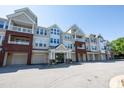 Desirable condo building featuring garage parking, well-kept exterior, and inviting entrance at 2810 Bedford Green Dr # 207, Raleigh, NC 27604