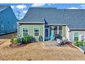Backyard features a patio area with outdoor furniture and a well-maintained lawn at 518 Judge Ct, Durham, NC 27703