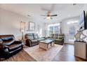 Bright living room featuring a large window, hardwood floors, and modern furniture at 518 Judge Ct, Durham, NC 27703