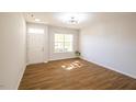 Inviting living room showcasing natural light, wood-look floors, and a fresh, neutral color palette at 6 Dawson Ct Ct, Durham, NC 27703