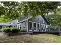 Spacious home exterior showcasing the expansive deck and backyard, perfect for outdoor entertaining and relaxation at 6765 Rock Service Station Rd Rd, Raleigh, NC 27603