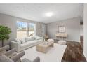 Bright living room with a comfortable white sofa and neutral accents at 7289 Nc 561, Louisburg, NC 27549
