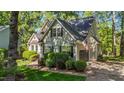 Beautiful home showcasing a side view, a well-maintained lawn, and an attached garage at 5113 Windance Pl, Holly Springs, NC 27540