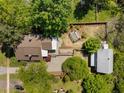 Aerial view showcasing a private backyard with a garden, pergola, and mature trees at 109 N Hassel St, Hillsborough, NC 27278