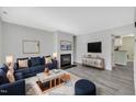 Inviting living room showcasing modern decor, a cozy fireplace, and stylish furnishings at 121 Drumbuie Pl, Garner, NC 27529