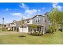 Well-maintained home with manicured lawn and landscaping at 130 Stromness Path, Clayton, NC 27527