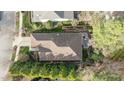 Aerial view of the property, showcasing the roof, landscaping, and outdoor patio area at 1320 Heritage Hills Way, Wake Forest, NC 27587