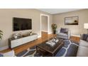 Cozy living room with hardwood floors, modern decor, and plenty of natural light at 154 Luther Rd, Raleigh, NC 27610