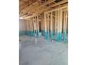 Interior view of a home under construction with exposed wooden framing and concrete floors at 156 Southern Middle School Rd, Roxboro, NC 27573