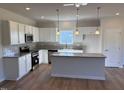 Bright kitchen with granite countertops, stainless appliances and island at 182 E Victory View Ter, Smithfield, NC 27577