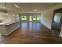 Spacious living room featuring hardwood floors and lots of natural light at 182 E Victory View Ter, Smithfield, NC 27577